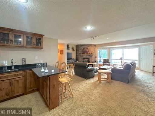 Lower level is made for entertaining with the wet bar opening seamlessly to the spacious lakeside family room.