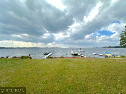 An expansive sandy beach and open yard leading to the shoreline, this property blends comfort and recreation.