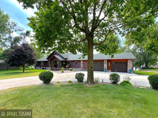 Experience lakeside living at its finest spanning over 6 acres of level land framed by mature gardens and towering trees.