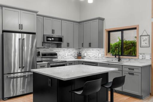 Large island, breakfast bar and tons of counter space