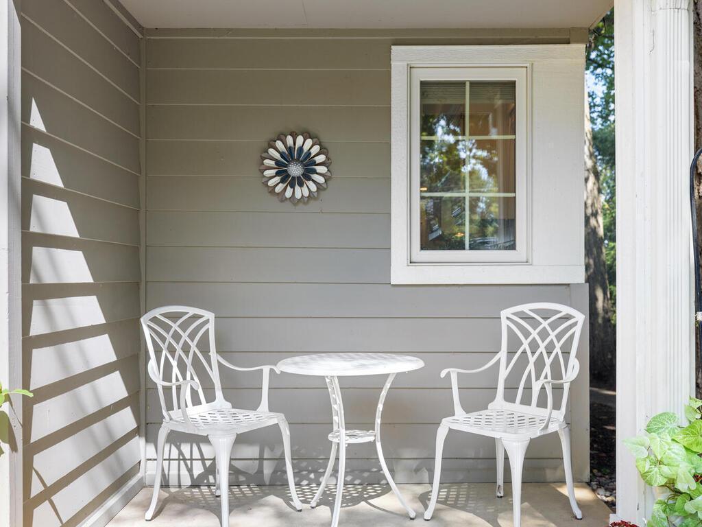 There is a covered porch to the right of the front entry.