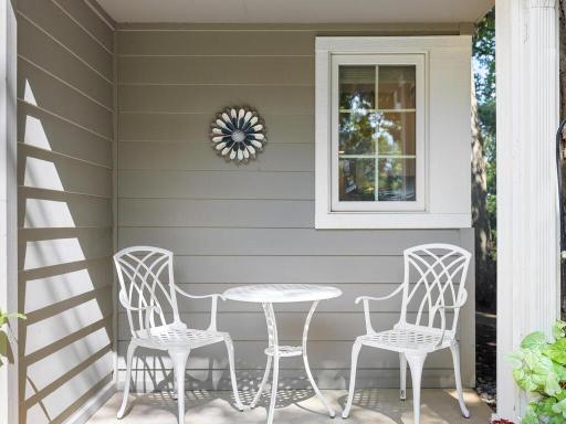 There is a covered porch to the right of the front entry.