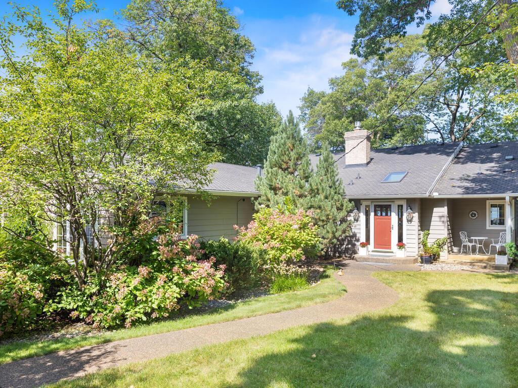 Charm and warmth radiate from this special one-level home the minute you step down the winding sidewalk and past the beautiful gardens giving a quaint and inviting feeling!