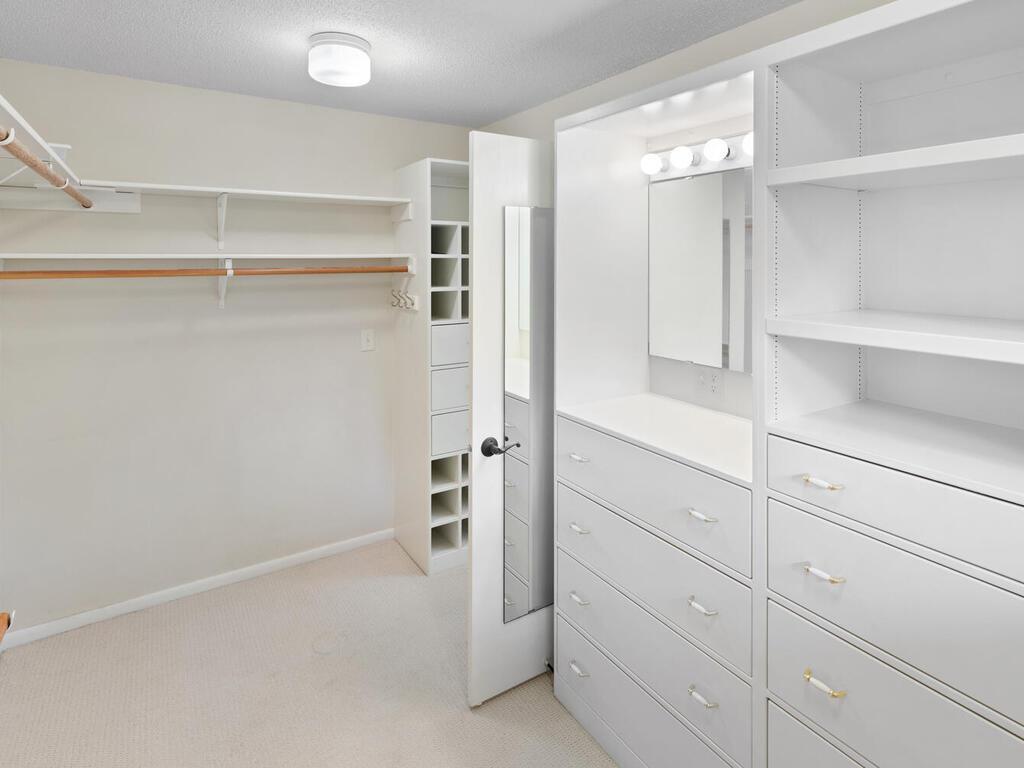 Owner's Suite offers a huge walk-in closet with custom built-in drawers, shelves and shoe storage.