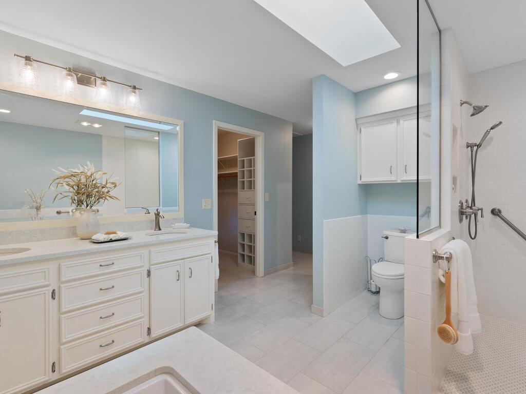 Owner's Bath has double vanity sinks, Cambria countertop, tile flooring!