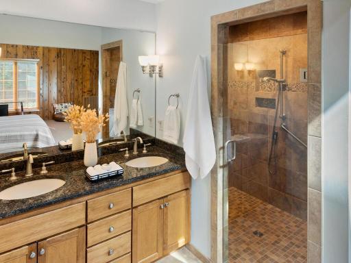Third Bedroom has updated double sink vanity w/granite countertop and wall sconce lighting.