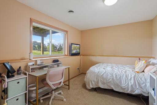 The home's third bedroom is in the lower level with lookout windows.