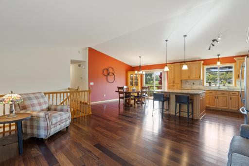 Bright, open-concept main level with vaulted ceilings and Andersen windows.