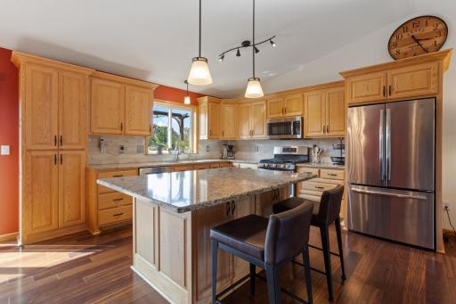 Kitchen upgrades include Cambria countertops, stainless steel appliances, updated cabinetry and lighting, cast-iron sink. Reverse osmosis filtered water at sink and refrigerator.