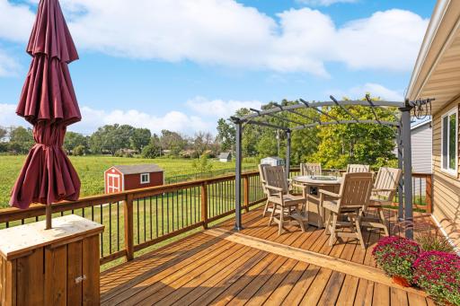 From the deck, a beautiful view of the backyard. Storage shed stays with the home.