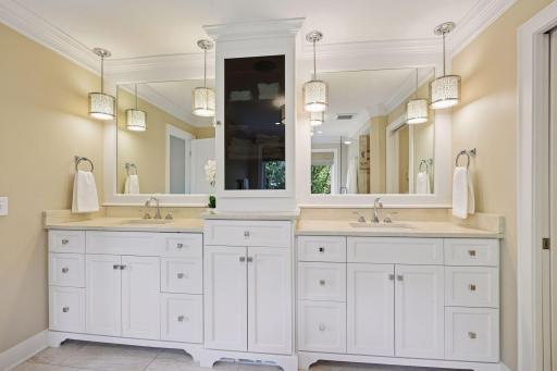 Gorgeous spa like primary bathoom with heated floors and separate toilet room.