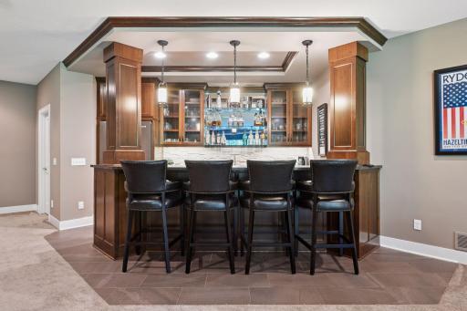 Beautiful full wetbar with refrigerator, dishwasher, and mircrowave.