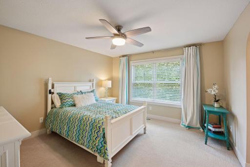 Fourth bedroom with private ensuite bathroom and walk-in closet.