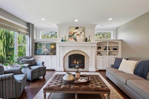 Great room with beautiful stone surround fireplace and built-ins.