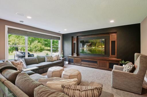 Built-in media wall with speakers and storage.