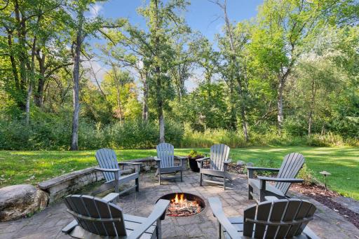 Paver patio with built-in firepit and outdoor lighting and speakers. Great for entertaining.