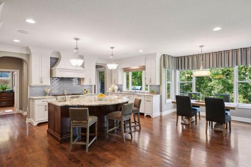 Gorgeous gourmet kitchen with large center island and prep sink.