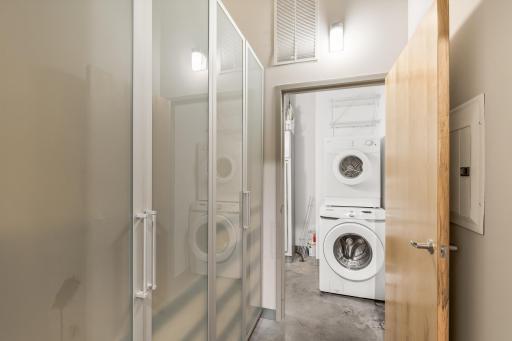 Primary bedroom closet and laundry closet