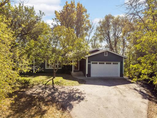 Tucked at the end of a quiet cul-de-sac, this home blends privacy, natural warmth, and modern comfort.
