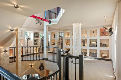This curated dreamscape ascends like a private art show, constellations of relics and curiosities dotting the halls.