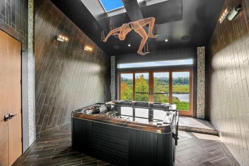 Further inside a hot tub glitters with surrounding sparkling grout.