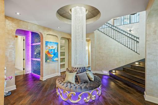 Anchored by a crystal centerpiece that scatters light as though the house itself is winking at you.