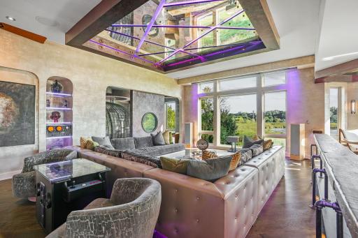 Walls painted, not papered, carry layers of color like the inner rings of tree trunks, while submarine controls and vintage lighting fixtures lend a sense of steampunk theater.