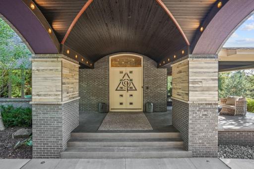 Step through the doors and into a threshold that feels less like an entryway and more like a spell.