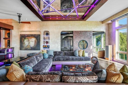 A sweeping custom couch invites you to stretch out, sink in, and forget the clock entirely.