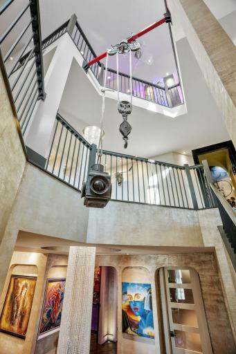The old hay trolley mechanicals from 1870, suspended between stairways, whispers that history and whimsy are equally at home here.