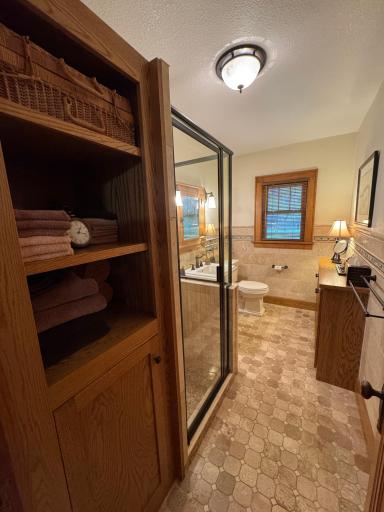 Main floor 3/4 bath with walk-in shower and infloor heat