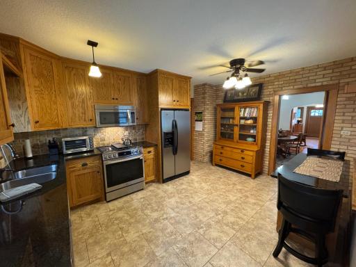 Kitchen with stainless steel appliances and in floor heat