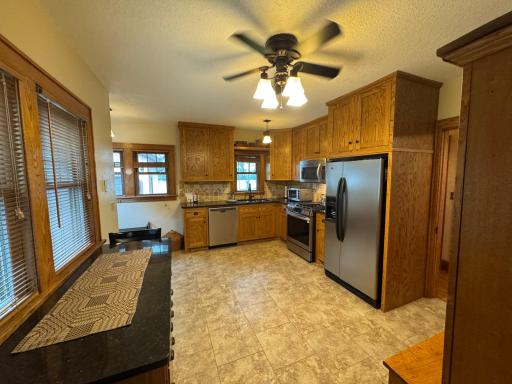 Kitchen with stainless steel appliances and breakfast bar