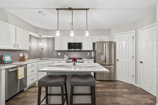 Prepare to be WOWED! This kitchen is the ultimate showpiece — stunning countertops, modern flair, and undeniable style.