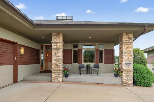 Welcome home to the Villas at the Wilds with this inviting front porch area.