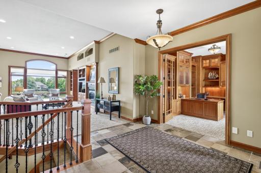Soaring ceilings and windows welcome you into this beautiful home.