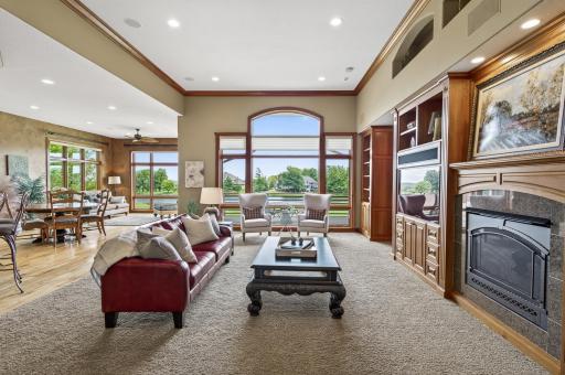 Fabulous open floor plan with breathtaking views, gas fireplace with granite surround, large built in tv and entertainment area.