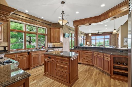 The ultimate chefs kitchen with cabinet pull outs, pot filler and convenient prep sink.