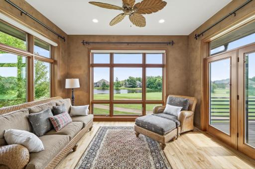 Sit back relax and enjoy the views from this main floor sunroom area
