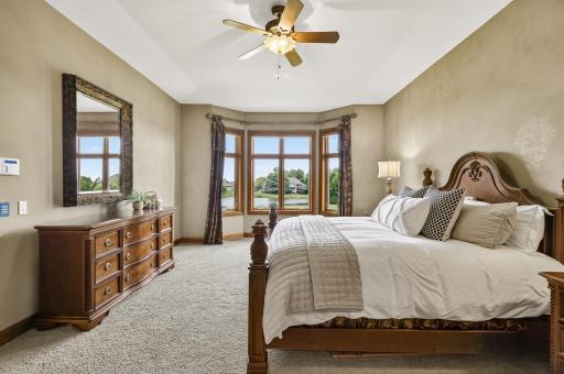 Primary main floor bedroom with breathtaking golf course and water views including sound and light system.
