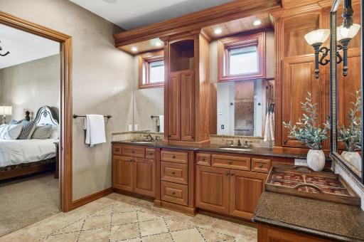 Main floor ensuite with daylight windows, double sinks custom tiled backsplash and granite.