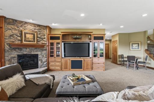 Stone fireplace and entertainment center with sound and light system sit back relax and enjoy your life here at the Wilds.