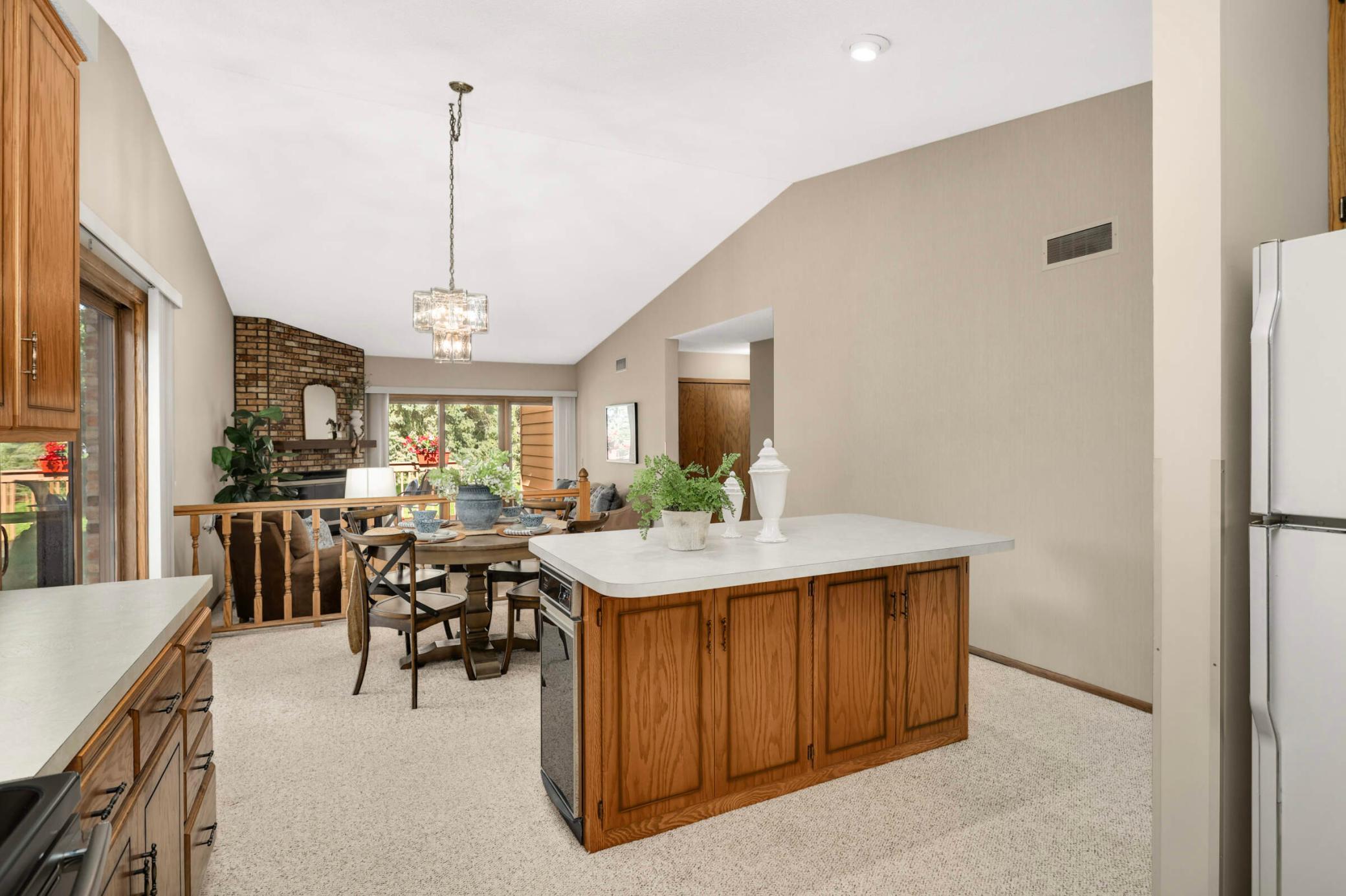 A bright and inviting living room with vaulted ceilings creates an open, airy feel