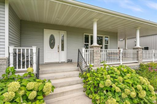 The front porch railings are low-maintenance vinyl, and the posts were just freshly painted. The soffit lights ensure you will be able to hang out on the porch even when the sun goes down.