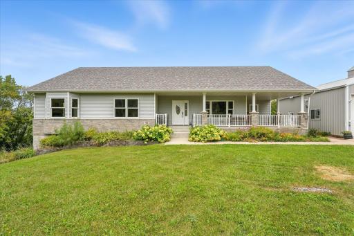The home has steel & brick siding, an enormous concrete front porch, Marvin Integrity windows and a 4-year-young roof.