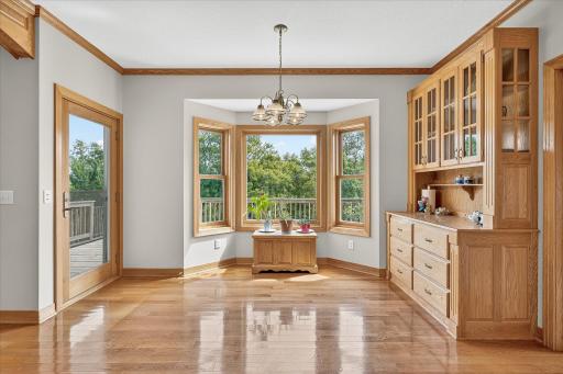 This informal dining space walks directly to the deck, making in/out entertaining a breeze, and even has a screen door attached to the deck door. And yes, that hutch cabinet is built-in.