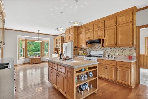The center island kitchen is fully loaded. Just look at those big & beautiful cabinets.