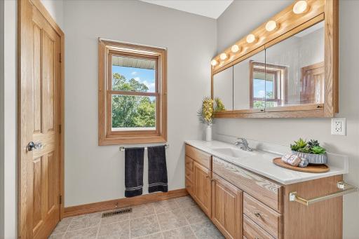 It has a solid oak door, with a glass knob, for the linen closet too!