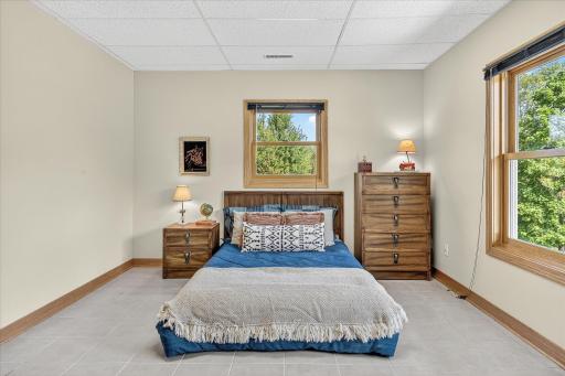 This bedroom overlooks the back yard and side yard.