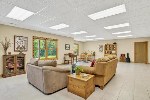 This rec/family room is absolutely huge! It features so much overhead light, ceramic tile flooring, and room for all your favorite activities.